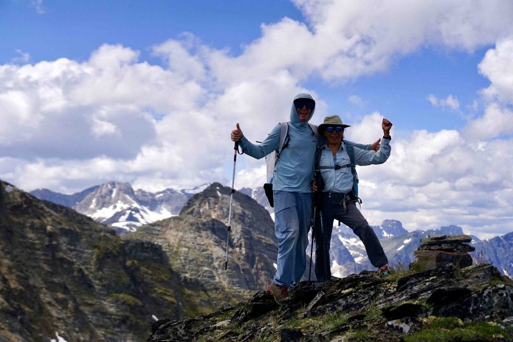 Hikers on the summit of Mount Rider with Rocky Mountain views